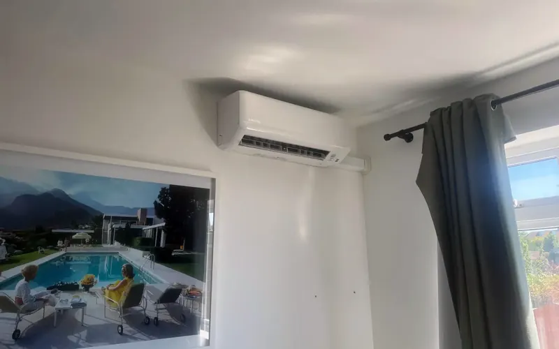 Wall-mounted air conditioning indoor unit in a Hove bedroom