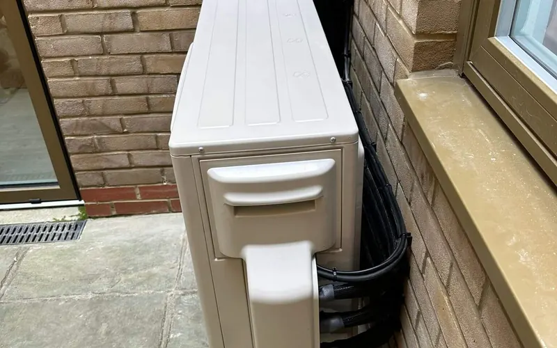 Outdoor condenser, residential air conditioning installation in Brighton (case study photo)