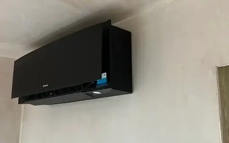 Black Daikin high-wall indoor unit