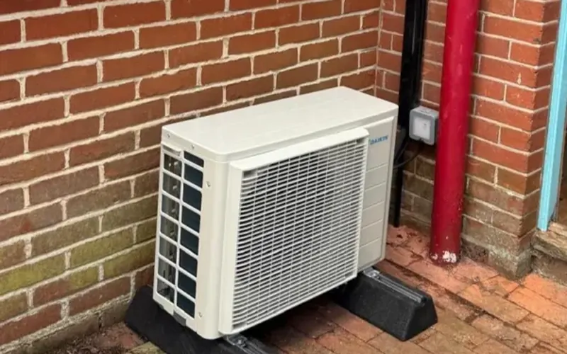 Outdoor air conditioning condenser at a Haywards Heath home