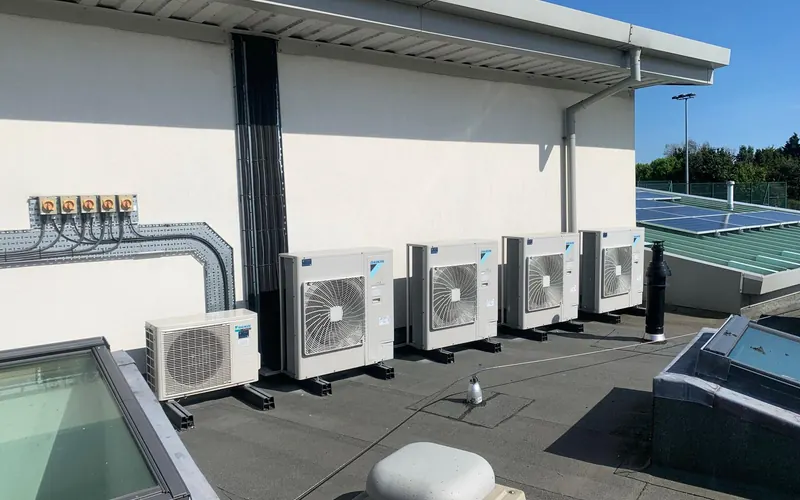 Row of outdoor units on a flat roof