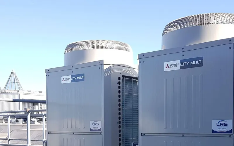 Two Mitsubishi Electric City Multi outdoor units on a roof terrace