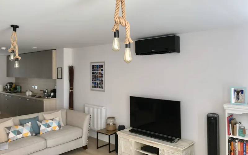 Black wall-mounted unit in a lounge kitchen