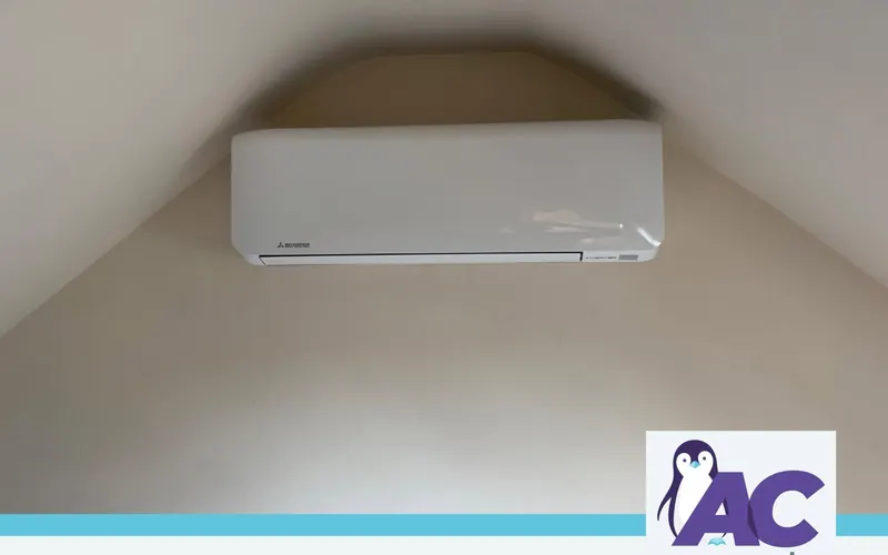 Wall-mounted indoor unit high on the wall of a vaulted room, small cottage multi split installation